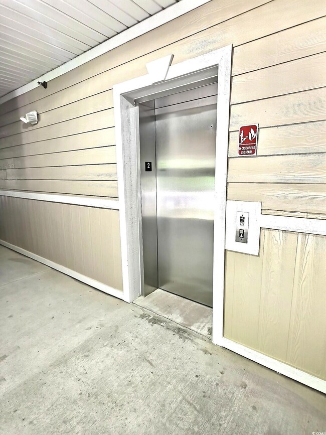 Property entrance featuring elevator