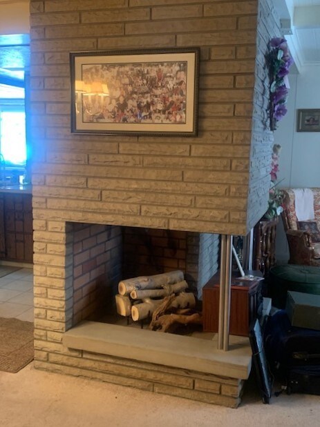 Closer view of the pretty stone gas Fireplace from