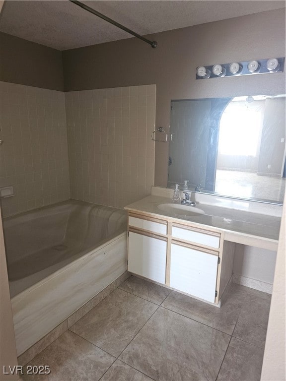 Bathroom featuring tile patterned floors, vanity,