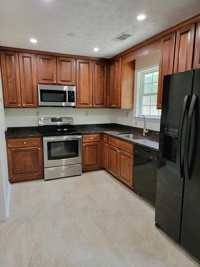 New granite in kitchen & new tile floors