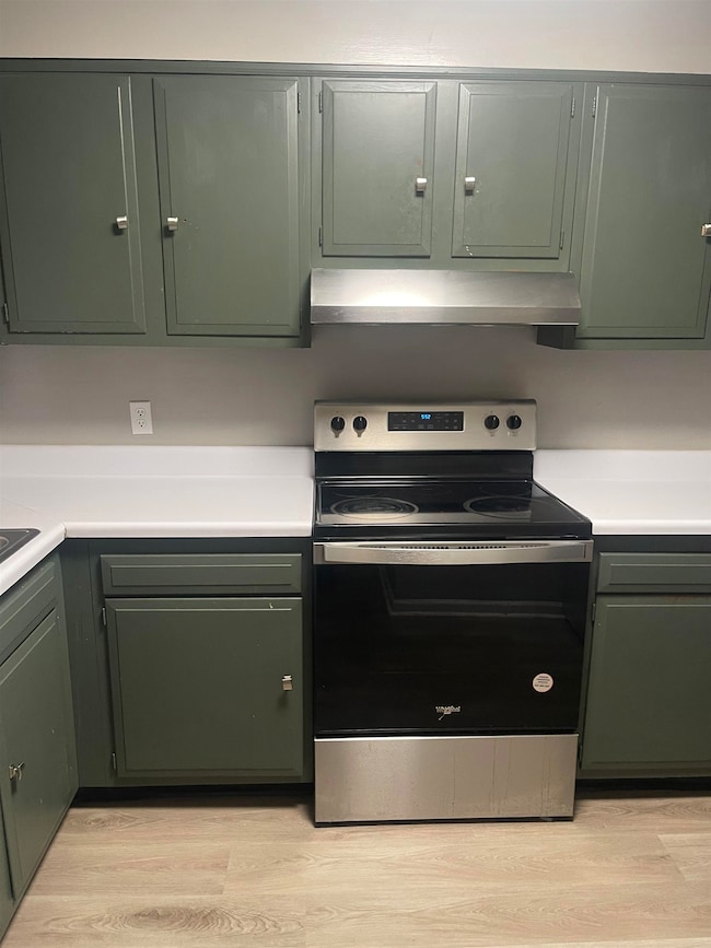 Kitchen featuring stainless steel electric range o