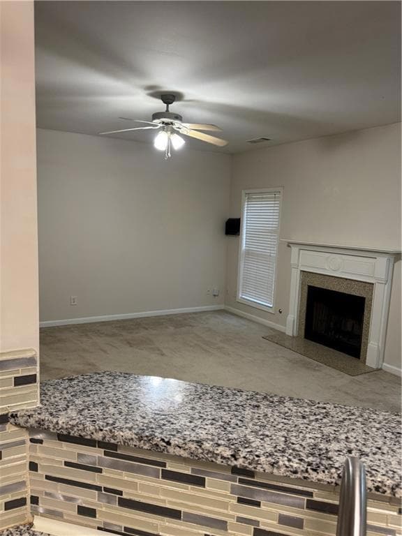 Unfurnished living room featuring visible vents, b