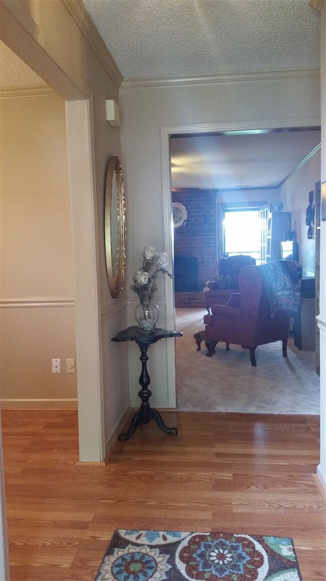 Entry hall has laminate wood flooring and opens to
