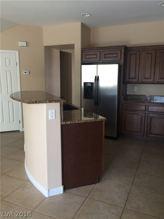 Granite counters, room for several stools at count
