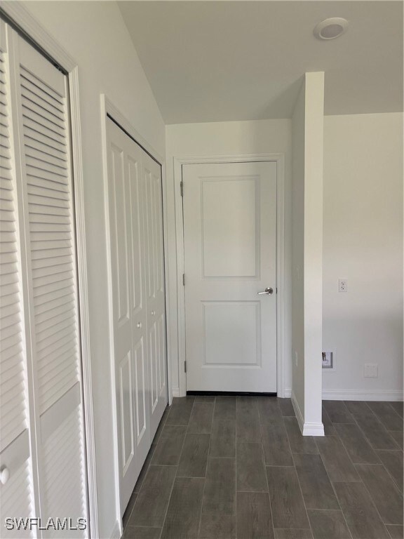 Hallway featuring baseboards