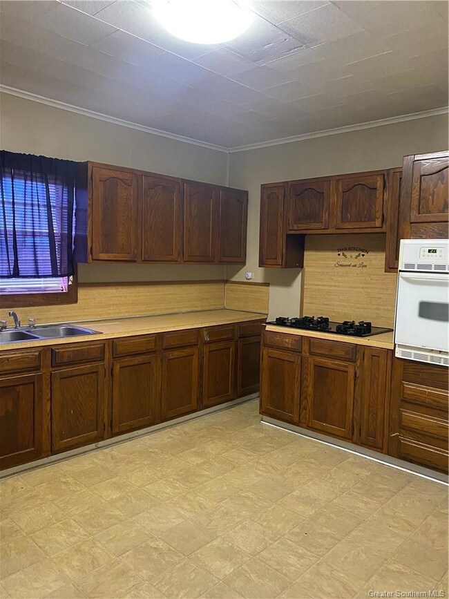 Kitchen with gas cooktop and built-in oven