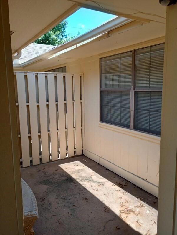Unfurnished sunroom with lofted ceiling