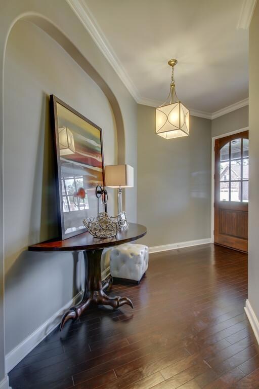 Interior doors throughout complement the front door. All are stained, with beautiful detail. 