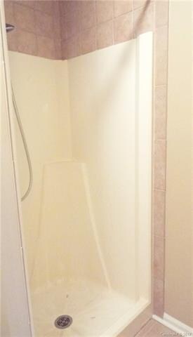 Master bath shower with ceramic back splash.