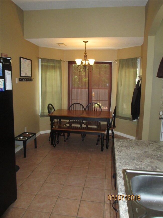 Dine right off kitchen and great room.  Tile floor