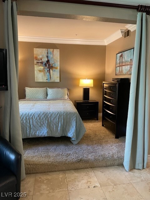 Bedroom with visible vents and ornamental molding