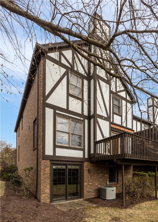 The rear of the home has a sliding Pella door from