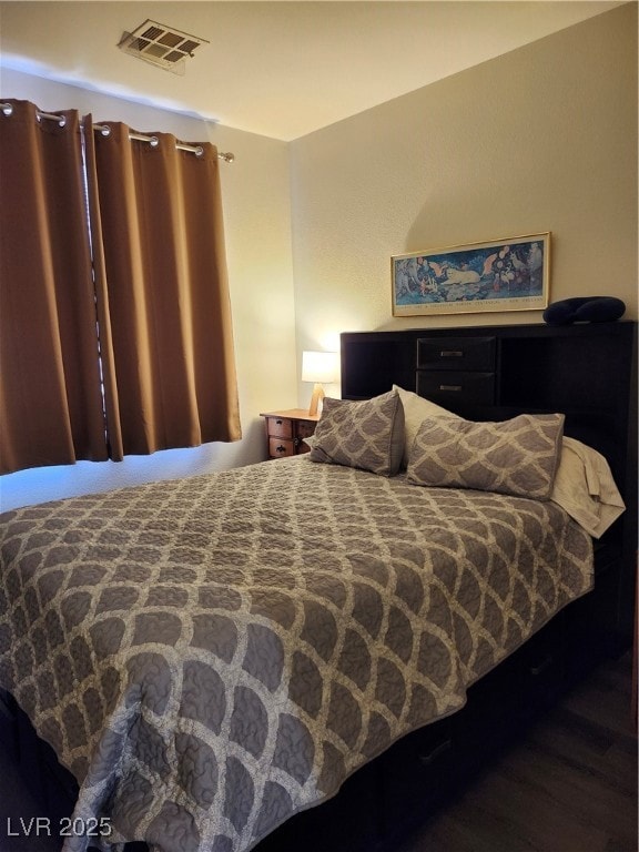 Bedroom with wood finished floors