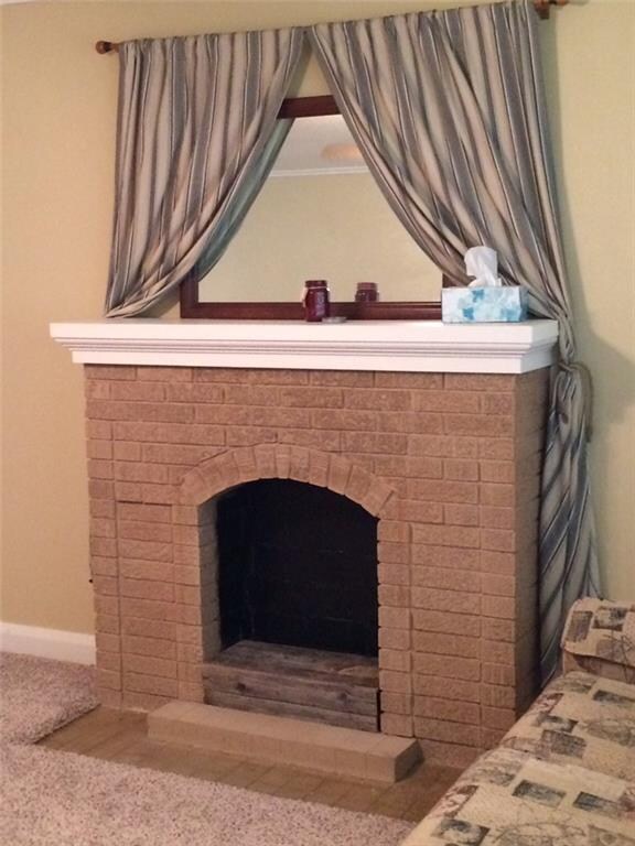 Fireplace on north wall of living room is now a mo