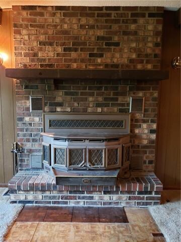 Gorgeous masonry fireplace with wood burning inser