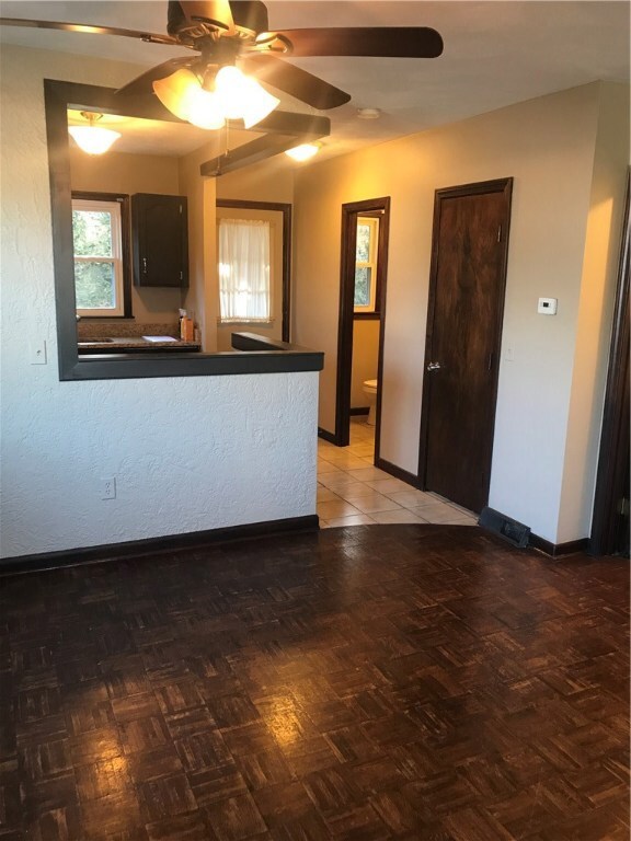 kitchen, back door leading out to fenced yard.
