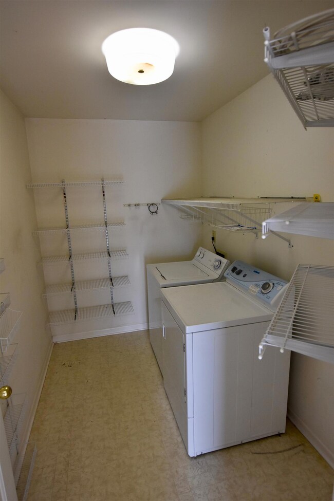 The laundry room is just off the kitchen with plenty of space to be a combo pantry/laundry room.