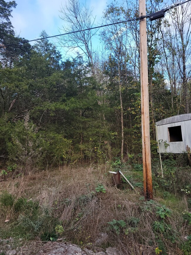Electrical pole already in lot.