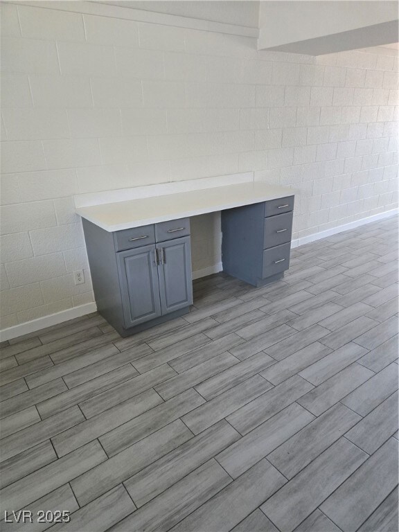 Detailed view of built in desk, concrete block wal