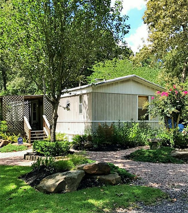 Beautiful front well manicured & professionally landscaped with 5 head sprinkler system