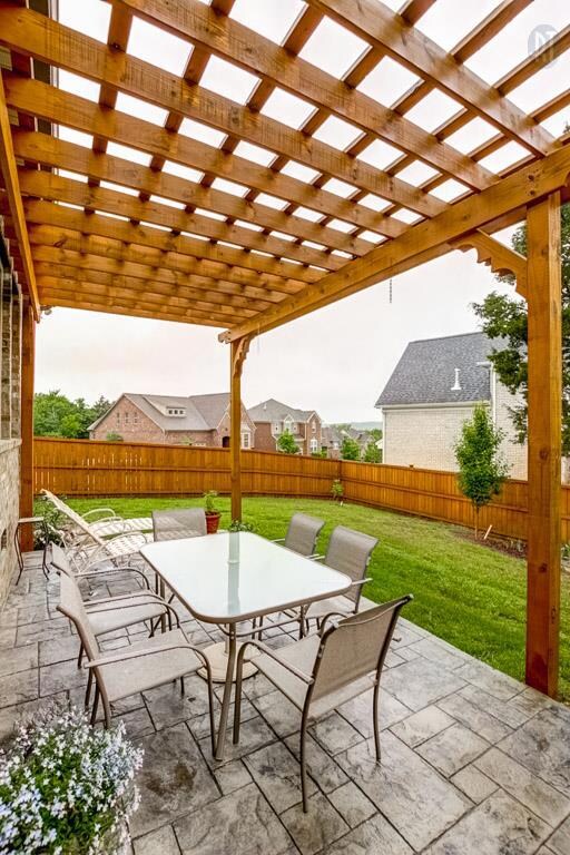 Step down from your covered patio onto this fabulous custom stamped concrete, arbor covered area!