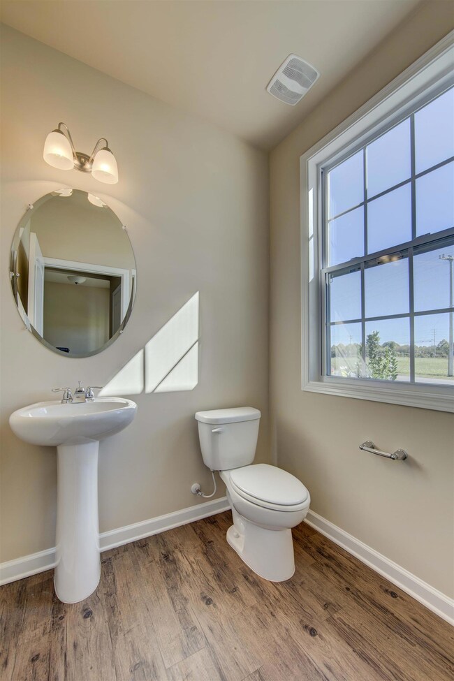 Light, bright Powder room.   All photos are of a similar property, not the listed property.