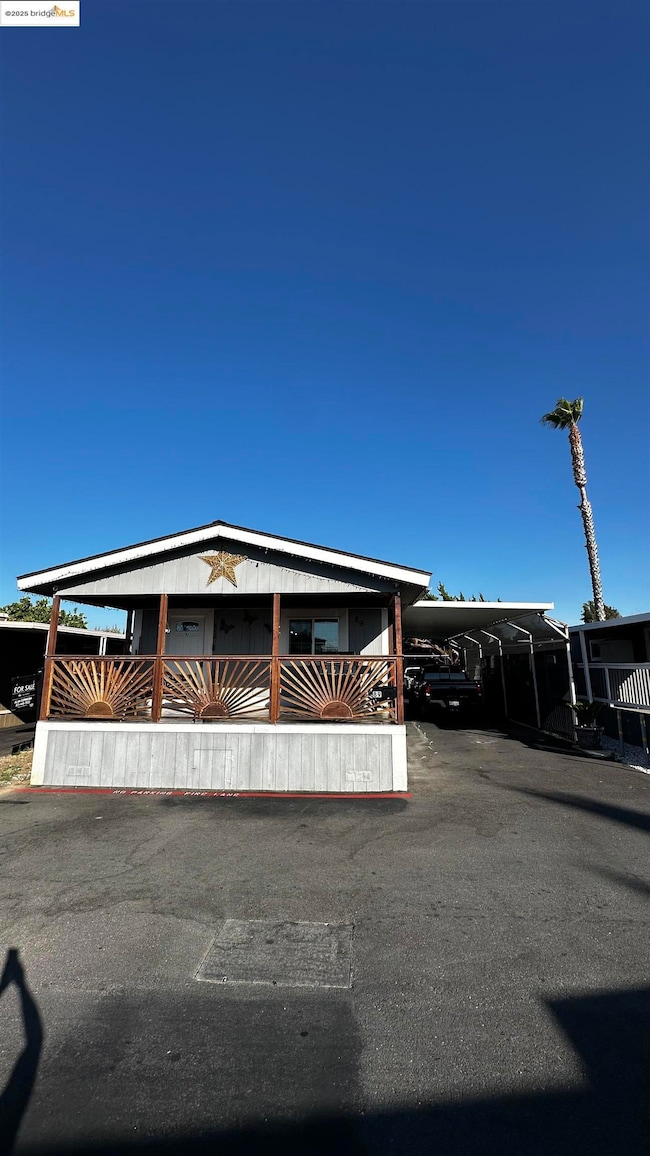 View of front facade featuring a carport