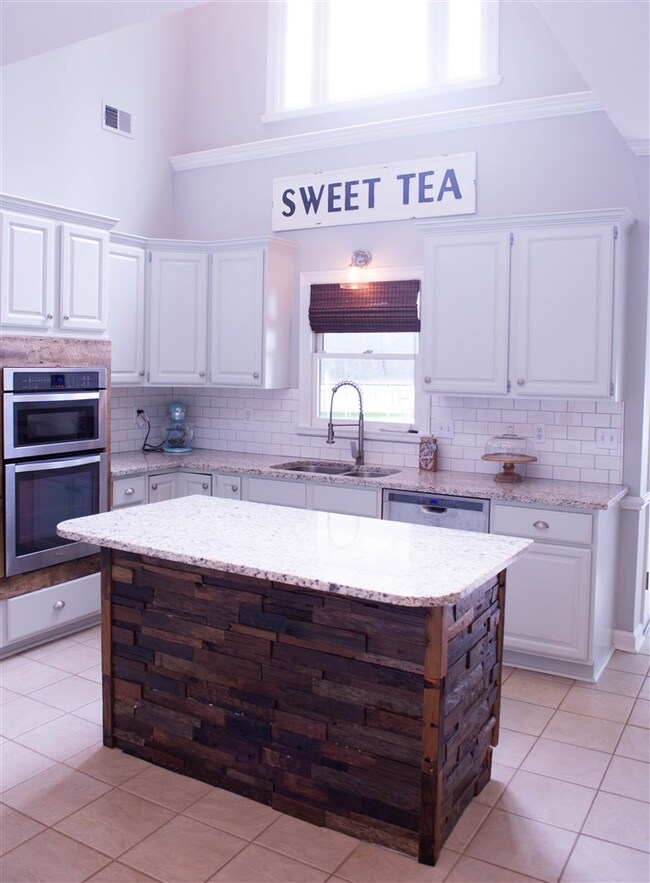 The two story kitchen area lets in a ton of light.
