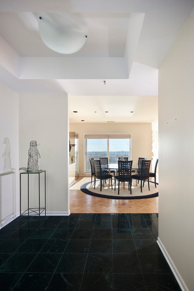 Vaulted Ceiling, marble floor, coat closet and des