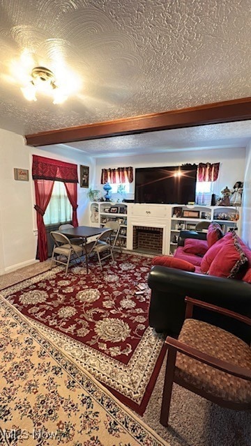 Living room featuring a textured ceiling and a fireplace