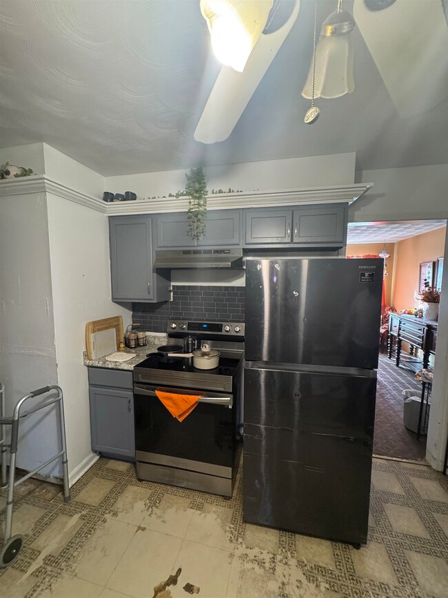 Kitchen featuring stainless steel electric stove, 