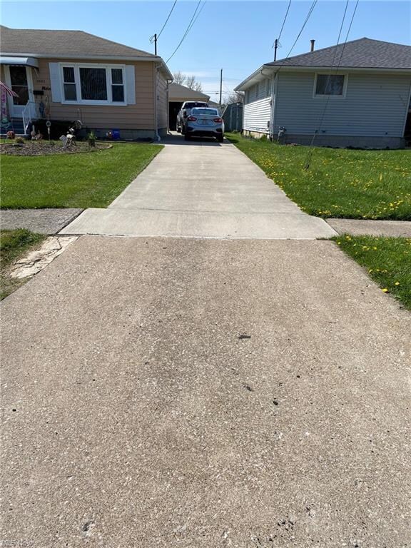 Enjoy the one and a half car detached garage
