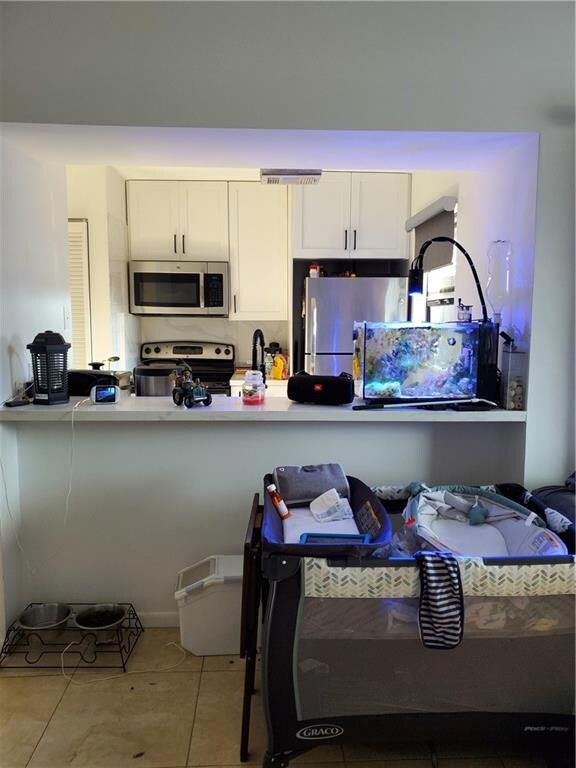 LIVING ROOM LOOKING INTO KITCHEN