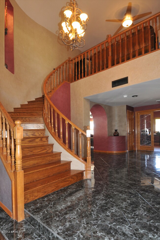 Foyer and circular wood stairs