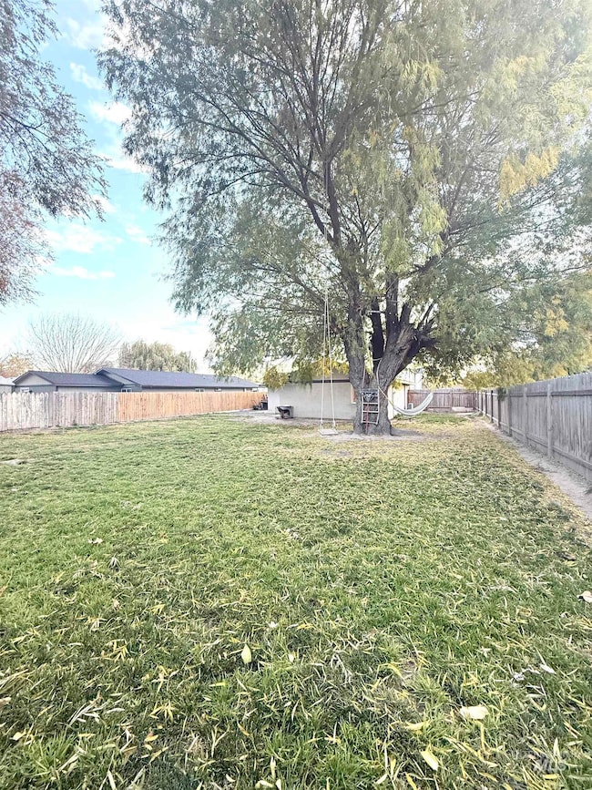 View of fenced backyard