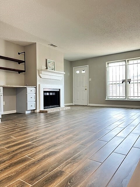 Living room with built in desk and fireplace