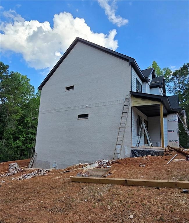 View of side of property with brick siding