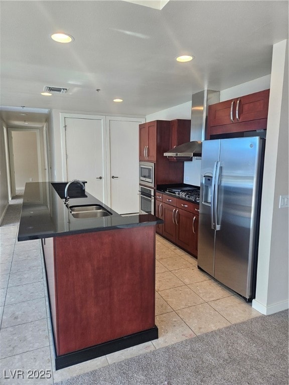Kitchen featuring fridge, a sink, dark countertops