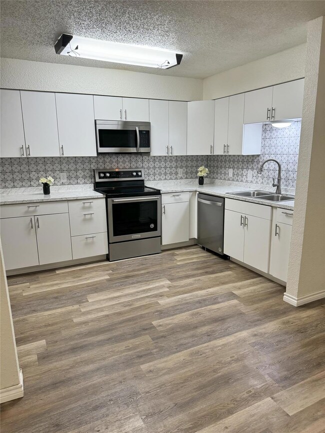 Kitchen featuring appliances with stainless steel 