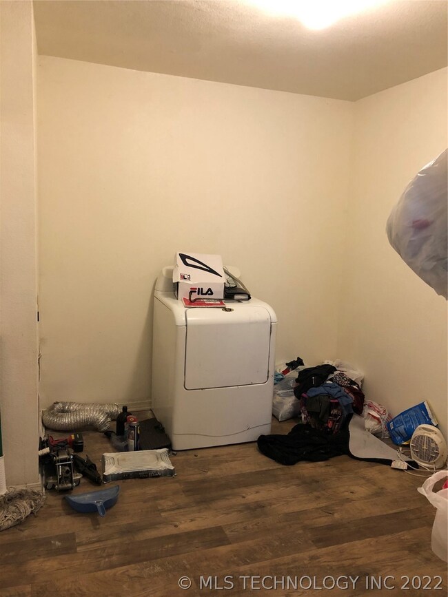 Laundry room is off kitchen/dining area and leads