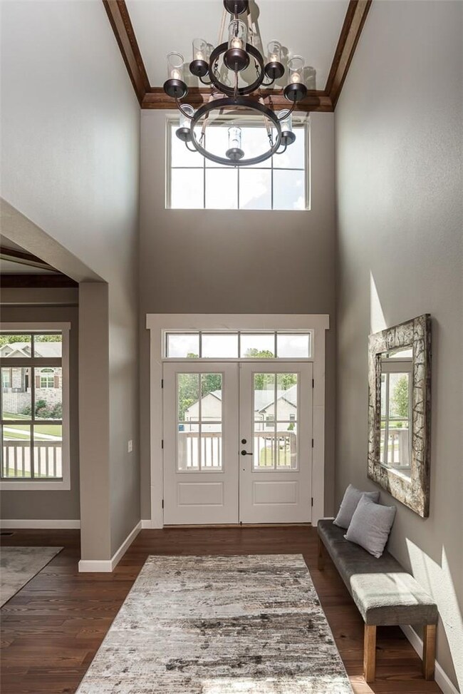 Double door grand entry with transom windows.