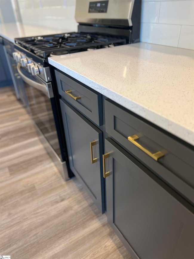 quartz, cabinet pulls, tile backsplash