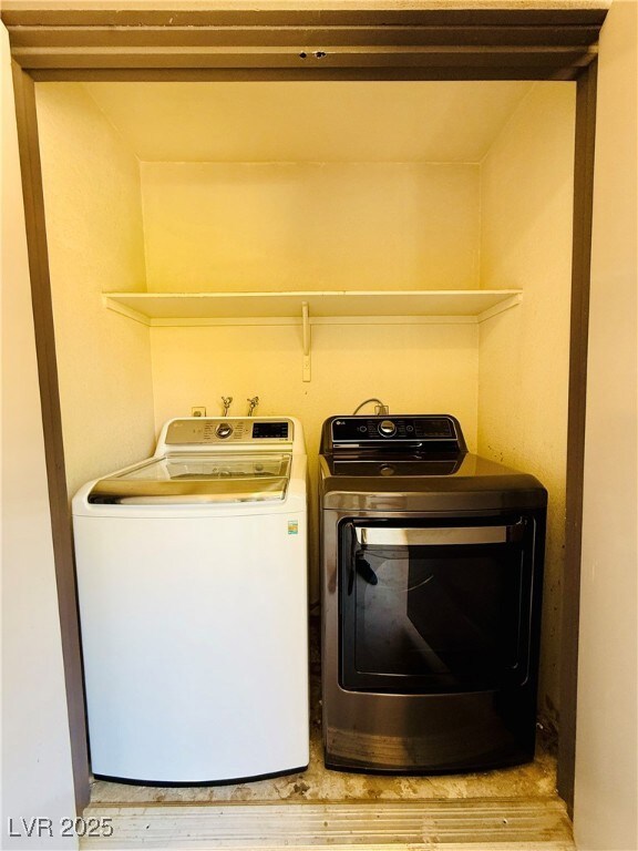 Laundry room with separate washer and dryer and wo