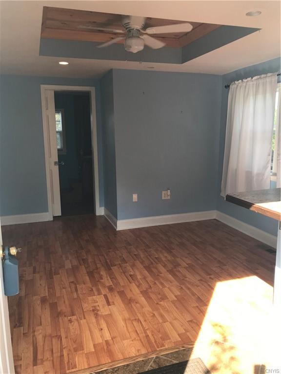 BIG CHEERY WINDOWS AND STUNNING FLOORING WARM THIS