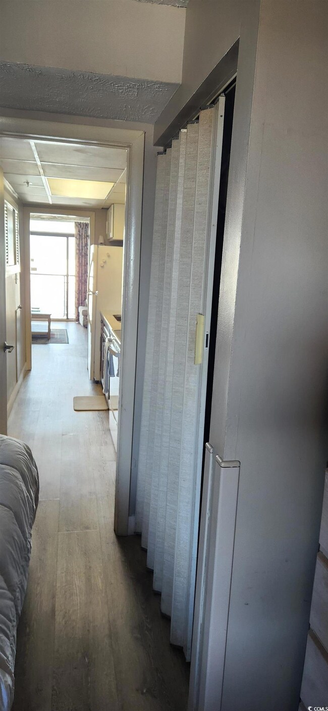 Hallway with light wood-style floors