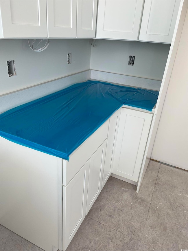 Interior space featuring white cabinets