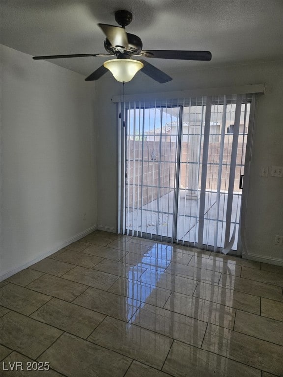 Empty room with a ceiling fan, plenty of natural l