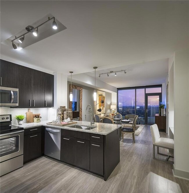 Kitchen with tasteful backsplash, rail lighting, k