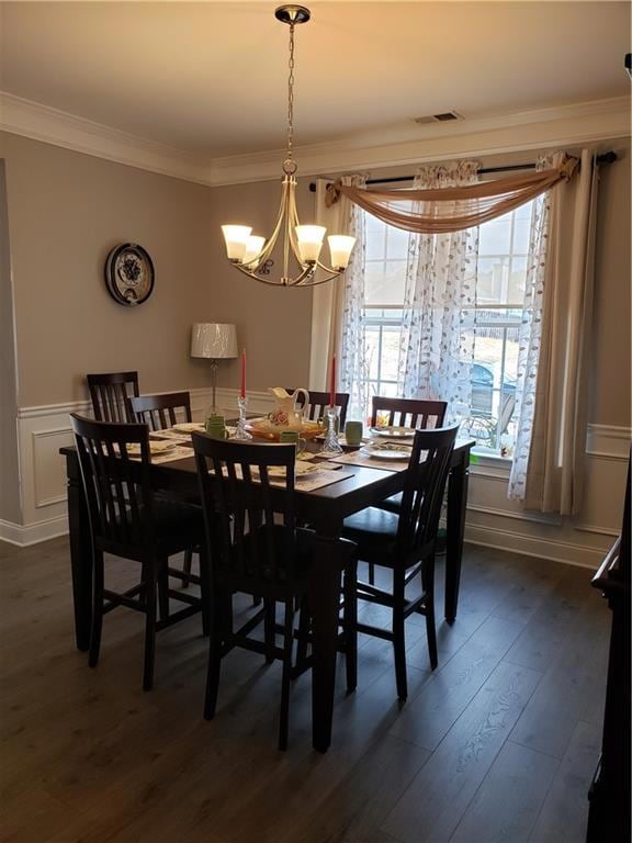 Dining room with dark hardwood / wood-style floors