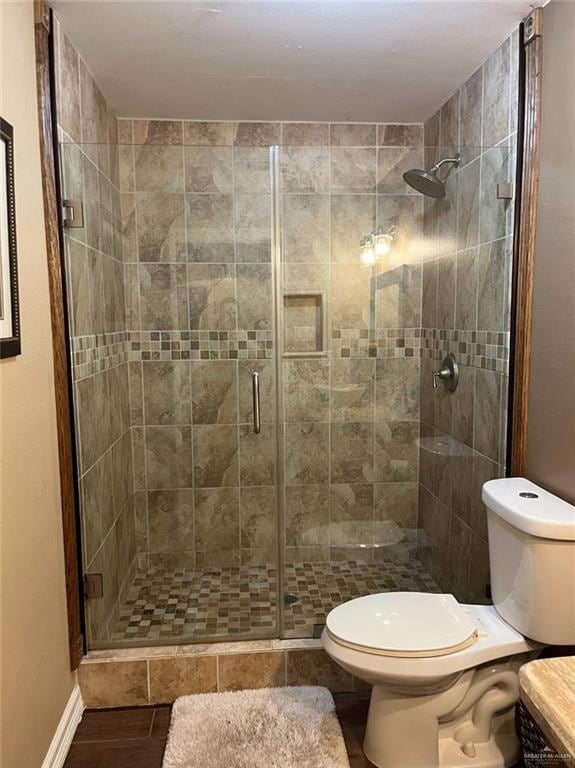Bathroom with toilet and a stall shower